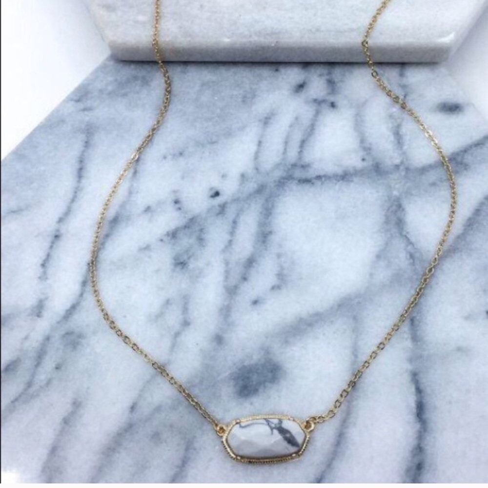 Gray stone necklace on a gold chain